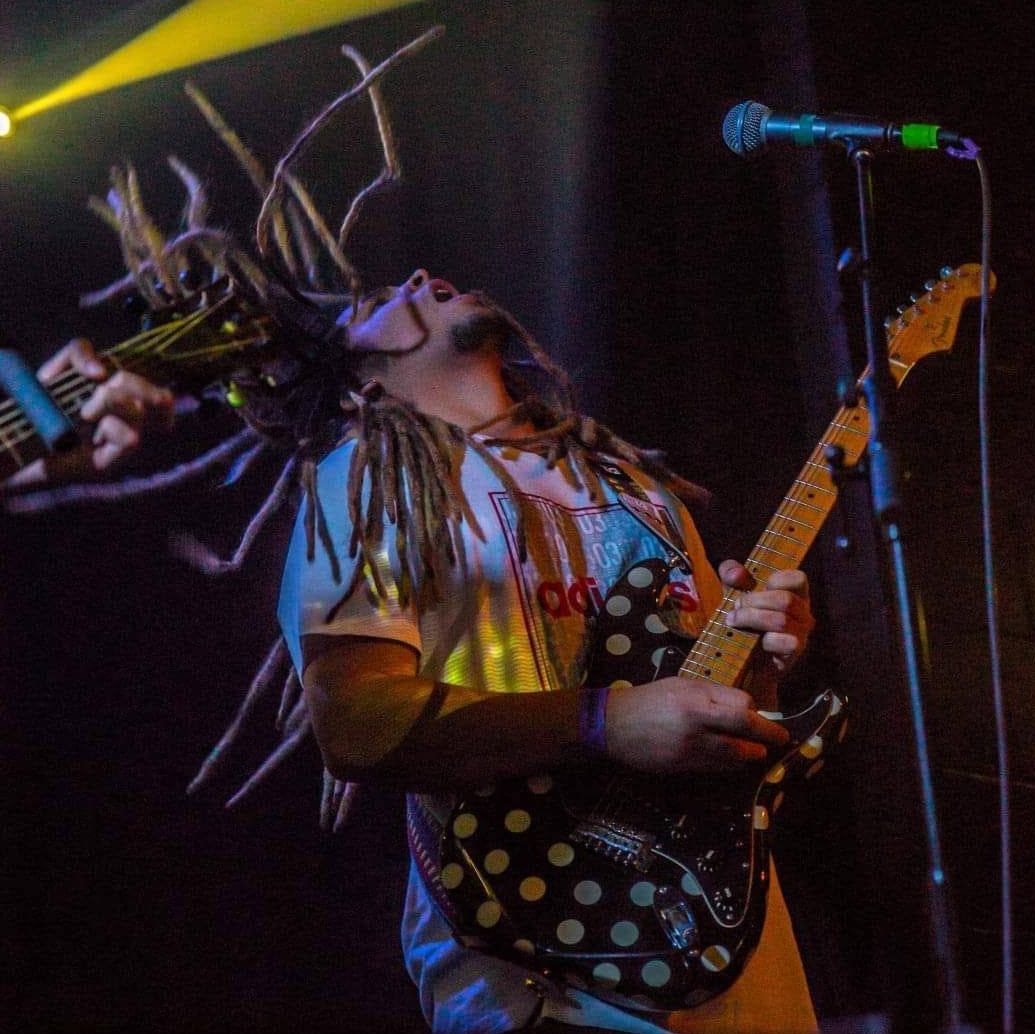 Zak performing live on guitar
